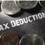 Image depicting money with the words tax deduction, to illustrate that this article is about section 179 deduction
